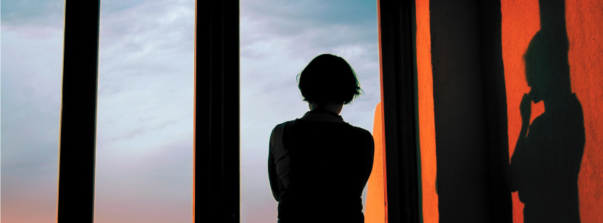 A female CEO pondering her leadership identity.